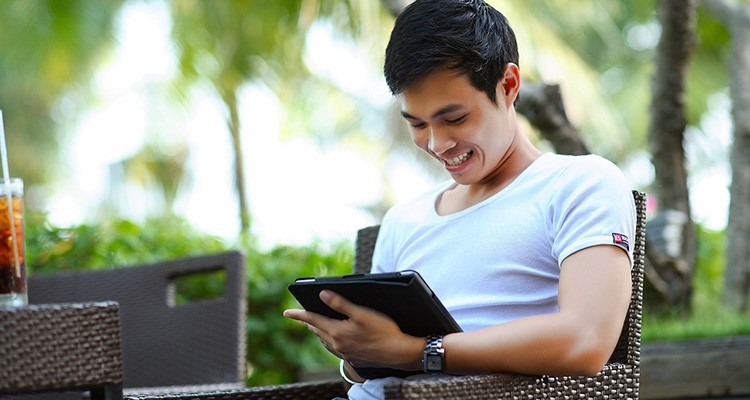 <?php the_title(); ?> thumbnail Man with ipad outside