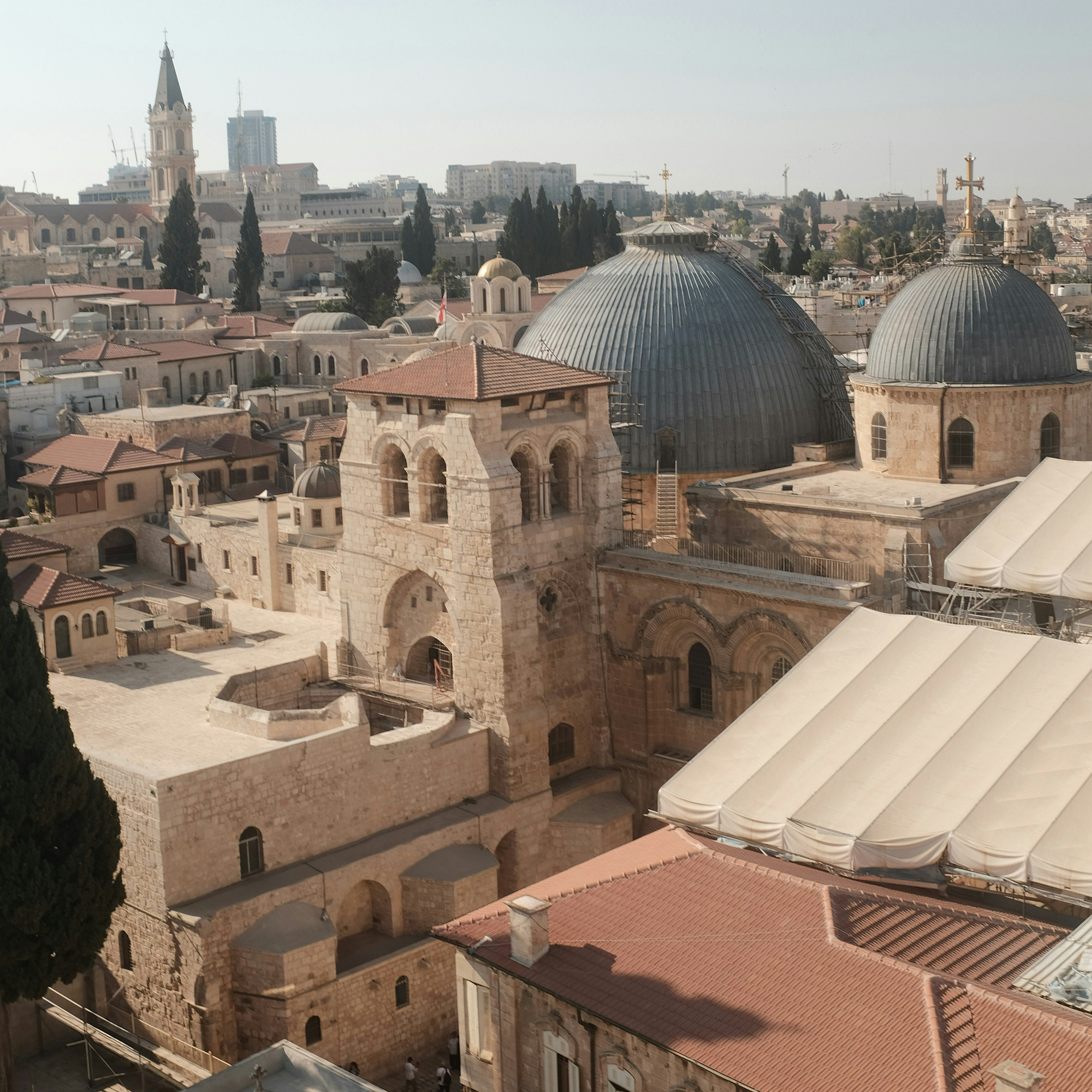 Scenic view from the dome overlooking the old city of Jerusalem, highlighting its ancient architecture and vibrant landscape.