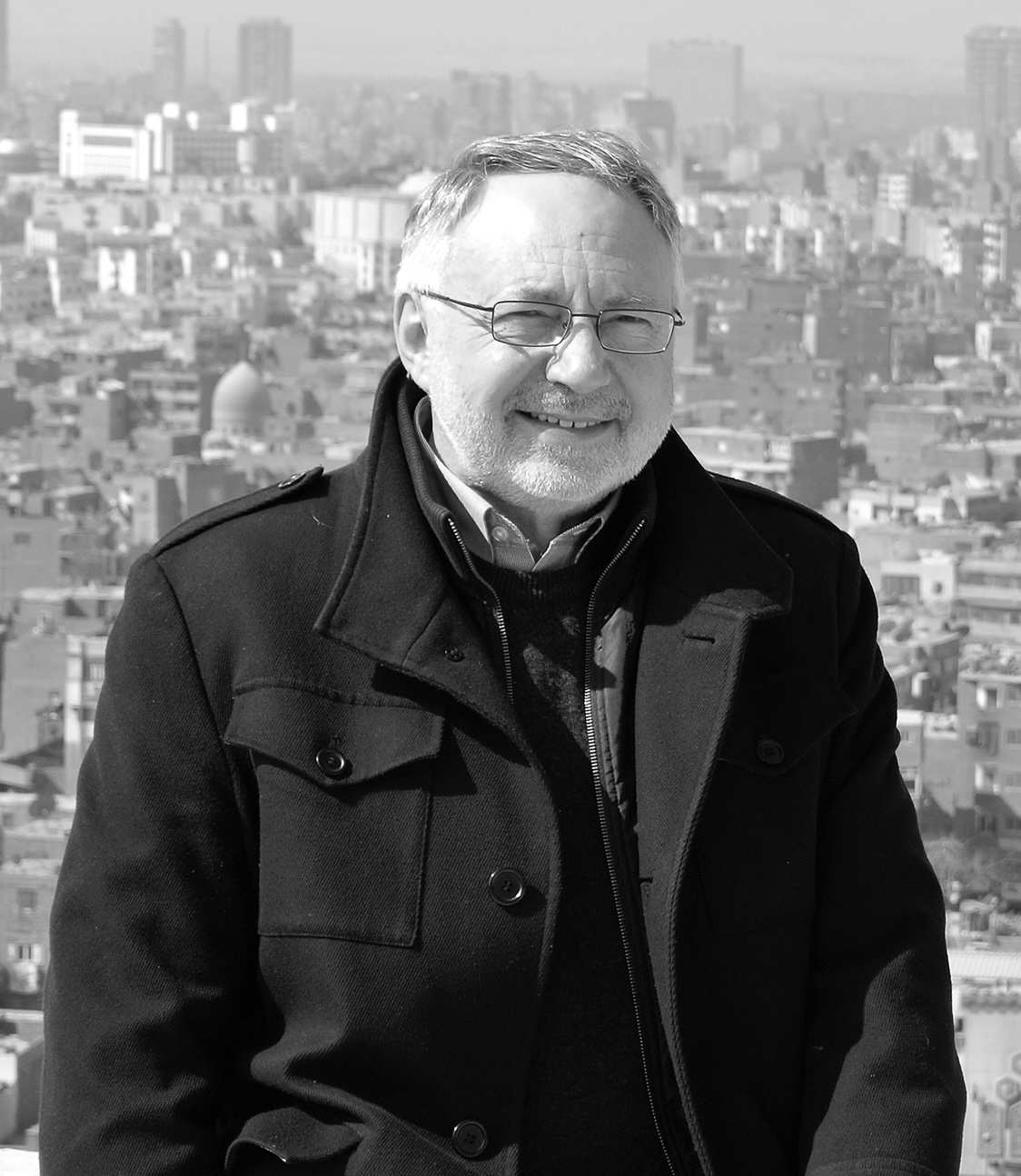 Portrait of Dr. Terence Ascott, World Outreach Week 2025 speaker, in front of the Cairo skyline.