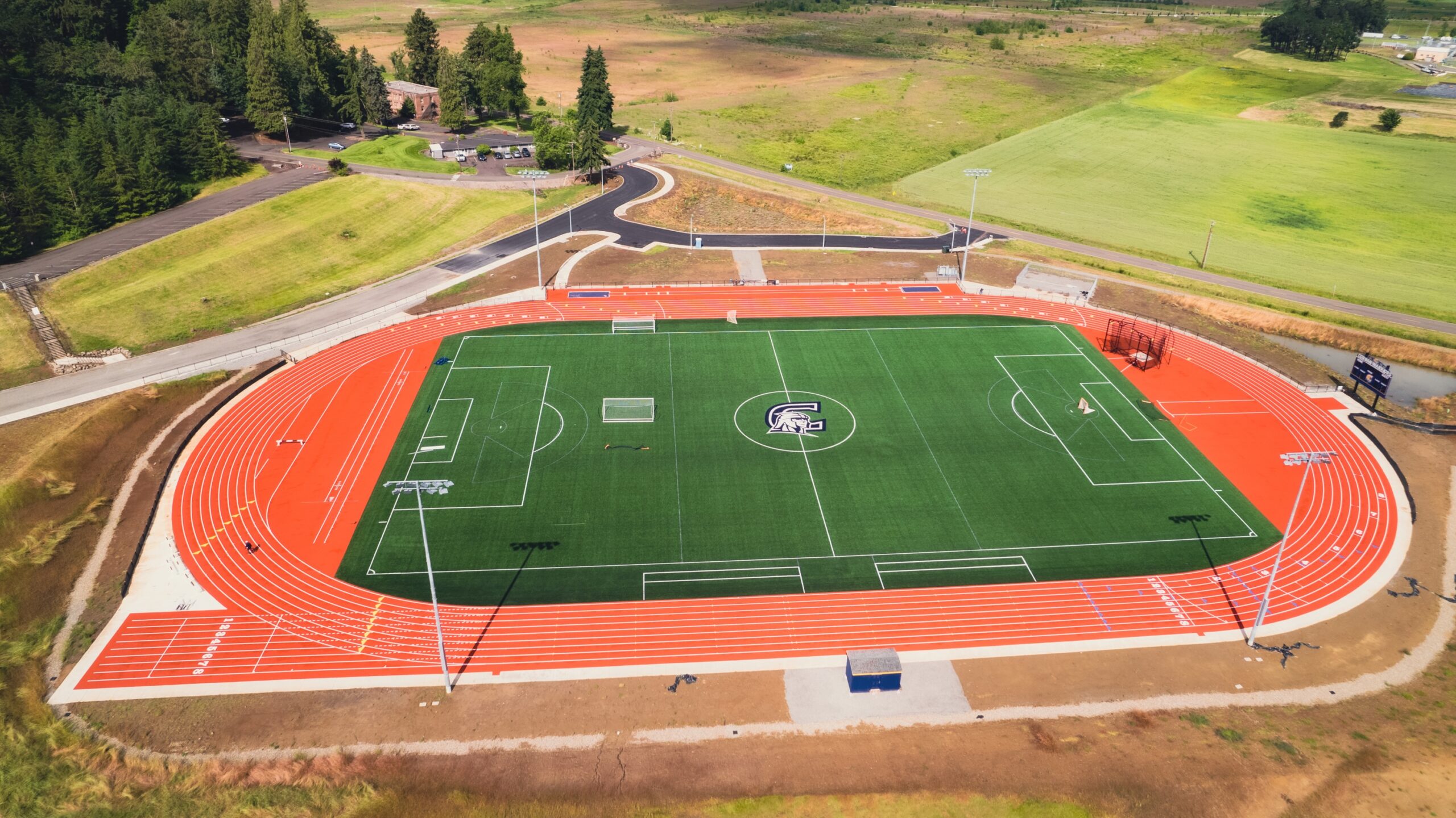 Aerial view of Corban's outdoor athletic complex, including a soccer field with track around it.