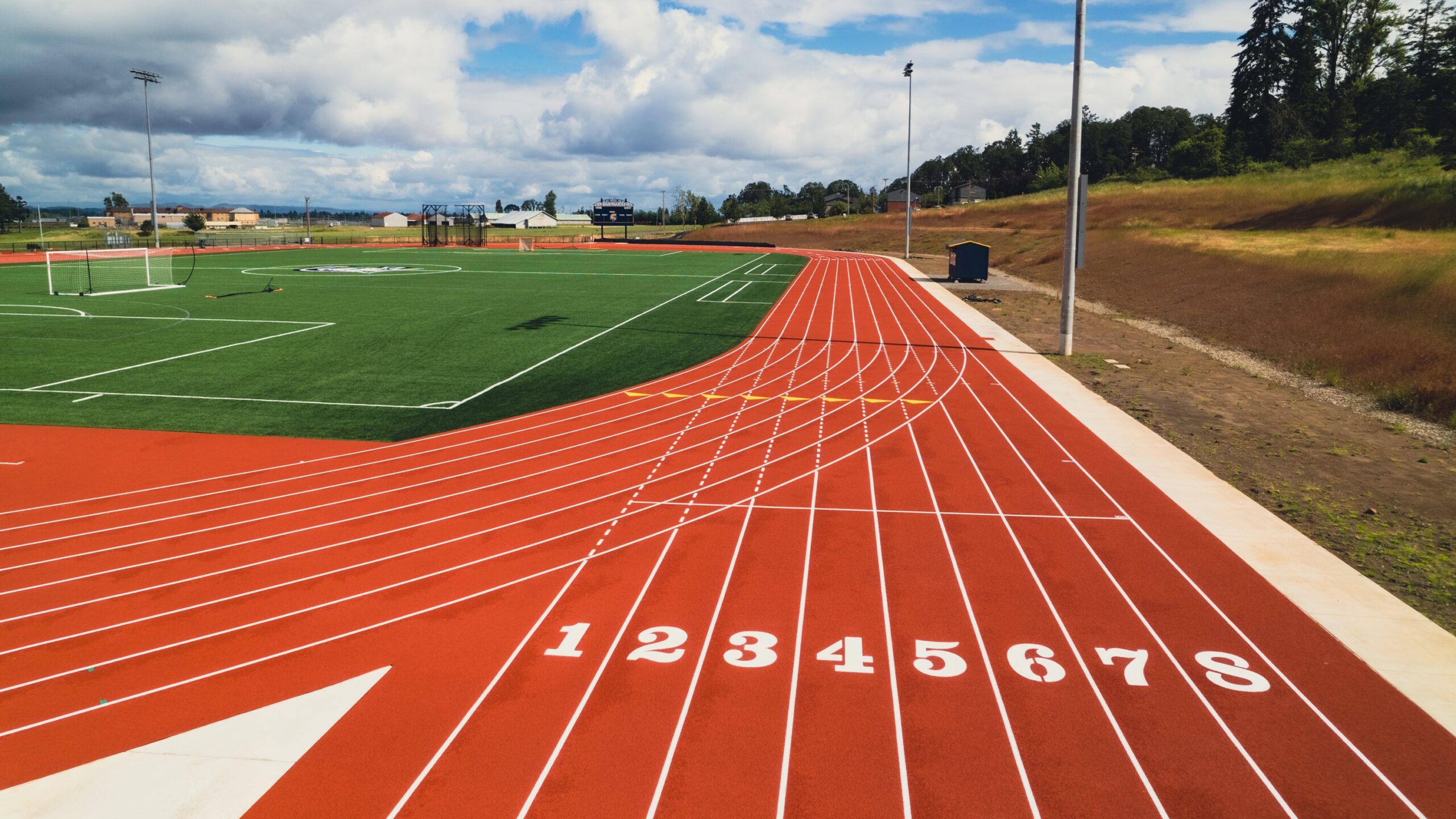 Corban's Outdoor Athletic Complex track featuring numbered lanes for competitive running and training activities.