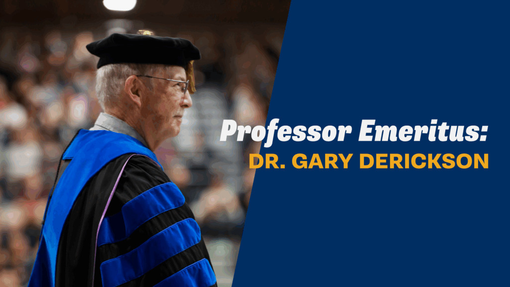 Dr. Gary Derickson in academic regalia at Corban University commencement, honored as Professor Emeritus