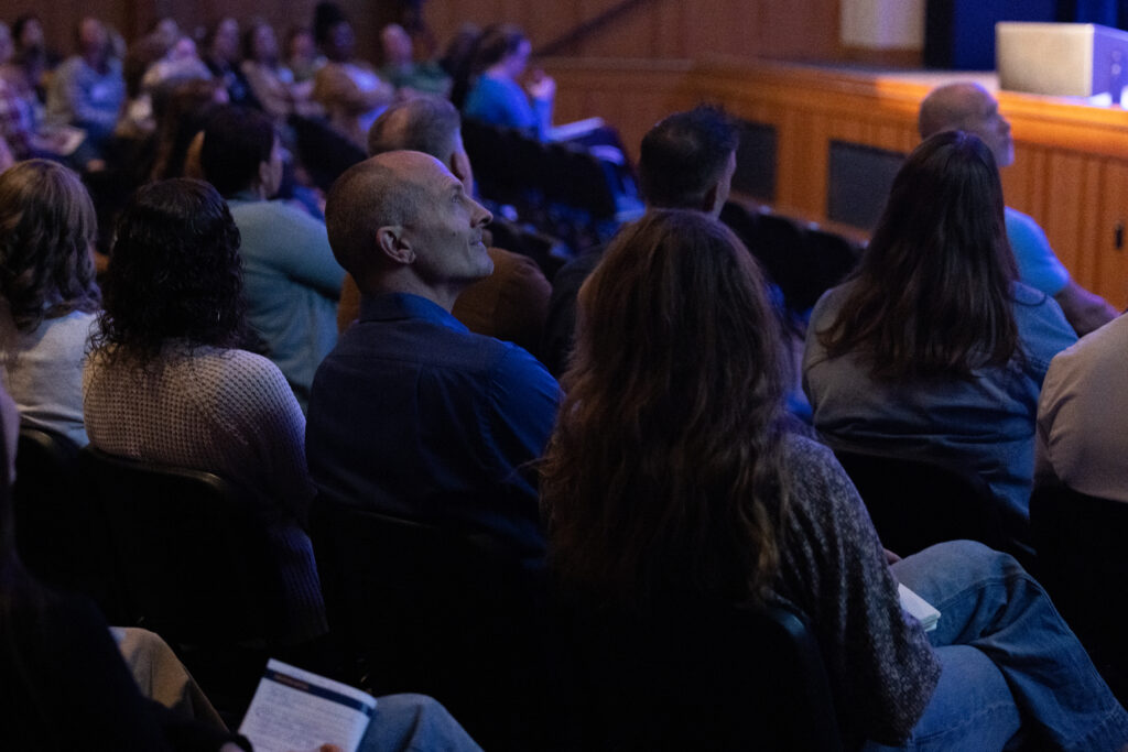 Attendees seated in an auditorium listen to a presentation during Corban University's fourth annual Christian Educators Conference.