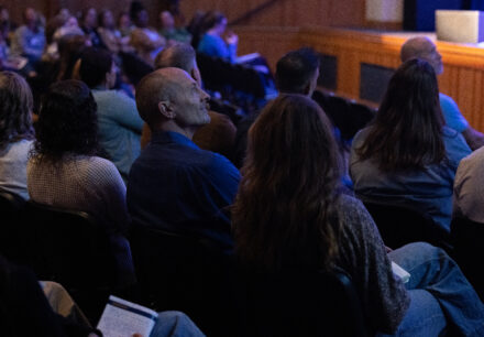 Attendees seated in an auditorium listen to a presentation during Corban University's fourth annual Christian Educators Conference.